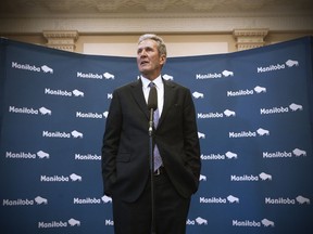 Manitoba premier Brian Pallister speaks to media after the tabling of his party's provincial budget was filibustered by the opposition NDP at the Manitoba Legislature in Winnipeg, Wednesday, March 11, 2020. The Manitoba government is to try again today to introduce its budget after the Opposition blocked it from being tabled.