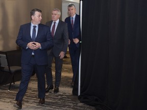 Prince Edward Island Premier Dennis King, Newfoundland and Labrador Premier Dwight Ball, and Nova Scotia Premier Stephen McNeil arrive for a press conference following the Atlantic Premiers Conference at the Emera Innovation Centre in St. John's on Monday. January 13, 2020. Canada's largest labour organization and the group that bills itself as the voice of business in this country have set aside their differences to jointly confront the economic fallout from the rampaging novel coronavirus ? and they're hoping premiers can do the same when they meet with Prime Minister Justin Trudeau.