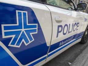 A Montreal police car is seen Friday, April 5, 2019 in Montreal. Police forces in Canada are getting extra powers, more flexibility and even help from citizens reporting on one another as governments seek to enforce decrees aimed at stopping the spread of COVID-19.