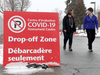 Nurses from the Ottawa Hospital walk outside the COVID-19 Assessment Centre.