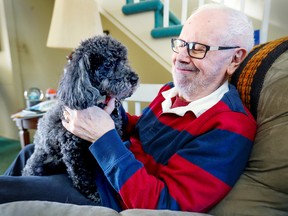 Mike Boone with QuaQua, “a 10-year-old miniature poodle who’s the smartest dog I’ve ever had (which is damning her with faint praise).”