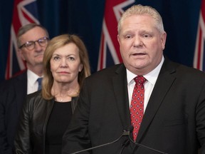 Ontario Premier Doug Ford with Minister of Health Christine Elliott and Ontario Chief Medical Officer of Health Dr. David Williams during a news conference at the Ontario Legislature in Toronto on March 16, 2020.