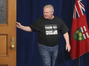Ontario Premier Doug Ford arrives for the daily COVID-19 press conference at Queen's Park in Toronto on Saturday, May 9, 2020.