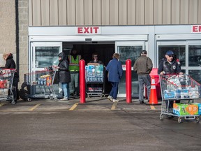 Many of the shopper leaving the south Edmonton Costco were buying vast quantities of toilet paper on March 3, 2020. Stores across Canada have been selling out of some supplies as people fall prey to fear mongering over coronavirus.