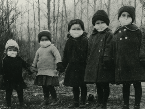 Canadian children wear masks during the Spanish Flu pandemic of 1918. The future of COVID-19 is likely to look something like past pandemics, which is to say it will peak, then pass.