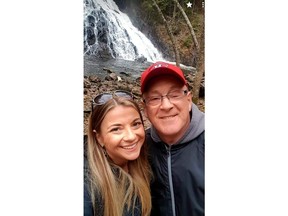 Kelly Marshall, left, and her father Rick Cameron pose for a selfie at a waterfall in Nova Scotia in an undated handout photo. The daughter of a Nova Scotia man relying on a ventilator for breath wants Canadians to recall COVID-19 can deny loved ones the ability to hold one another in their time of deepest need.THE CANADIAN PRESS/HO-Kelly Marshall, *MANDATORY CREDIT*