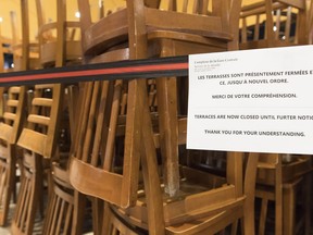 A sign notifying customers of a closed terrace is shown at food court in Montreal, Wednesday, March 18, 2020, as COVID-19 cases rise in Canada and around the world.