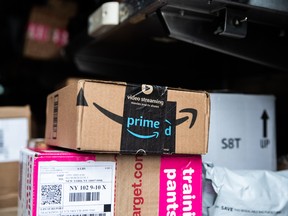 An Amazon package is seen on a delivery truck