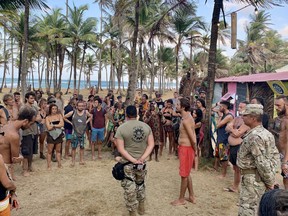 Panamanian military personnel giving instructions to attendees of Tribal Gathering Festival