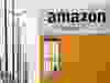 The logo of Amazon is seen at the company logistics center in Lauwin-Planque, northern France, March 19, 2020.