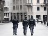 Police walk on an empty street in Milan on the third day of an unprecedented lockdown across of all Italy imposed to slow the outbreak of coronavirus, March 12, 2020.