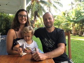 Emmanuel Samoglou, his wife, Nicole Adoranti and their two-year-old daughter pose in this undated handout photo. A Canadian family on a round-the-world trip plans to ride out the COVID-19 pandemic on a remote island in the south Pacific Ocean. Emmanuel Samoglou, his wife, Nicole Adoranti and their two-year-old daughter are in a small home in idyllic Rarotonga, a part of the Cook Islands.
