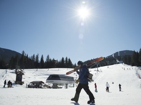 A ski instructor is seen walking along the base of Whistler Mountain in Whistler, B.C. Sunday, March 15, 2020. The Whistler Blackcomb resort which is owned by Vail Resorts shut down operations Saturday due to the ongoing COVID-19 crisis taking place worldwide.