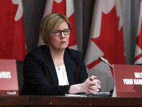 Minister of Employment, Workforce Development and Disability Inclusion Carla Qualtrough listens during a press conference on COVID-19 at West Block on Parliament Hill in Ottawa, on Wednesday, March 25, 2020.