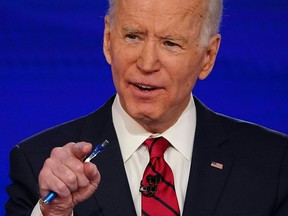 Democratic presidential hopeful former U.S. vice-president Joe Biden debates Sen. Bernie Sanders in Washington, D.C., on March 15, 2020.