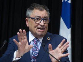 Horacio Arruda, Quebec director of National Public Health responds to reporters during a news conference on the COVID-19 pandemic, Tuesday, March 31, 2020 at the legislature in Quebec City.