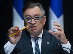 Horacio Arruda, Quebec director of National Public Health responds to reporters during a news conference on the COVID-19 pandemic, Wednesday, March 25, 2020 at the legislature in Quebec City. Montreal's first COVID-19 death was part of the city's Hasidic Jewish community.