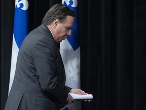 Quebec Premier Francois Legault leaves a news conference on the COVID-19 pandemic, Tuesday, March 31, 2020 at the legislature in Quebec City.