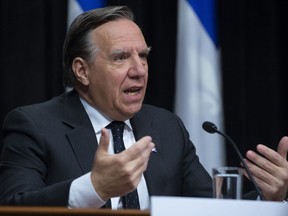 Quebec Premier Francois Legault responds to reporters questions at a daily news conference on the COVID-19 situation, Tuesday, March 17, 2020 at the legislature in Quebec City. Quebec's premier called on anyone large social media following to pass a message to Quebec teens and youth to stay inside and those influencers have heeded the call.