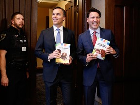 Finance Minister Bill Morneau, left, and Prime Minister Justin Trudeau arrive at the House of Commons before tabling the federal budget in Ottawa, on March 19, 2019.