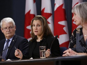 Deputy Prime Minister Chrystia Freeland, Transport Minister Marc Garneau and Health Minister Patty Hajdu during a news conference in Ottawa on March 16, 2020.