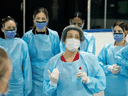 Medical staff prepare to receive patients for coronavirus screening at a temporary assessment centre at a hockey arena in Ottawa on March 13, 2020.