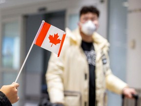 A traveller wears a mask at Toronto's Pearson airport.