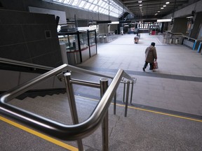 A lone commuter enters a subway station in Montreal on Thursday, March 19, 2020.
