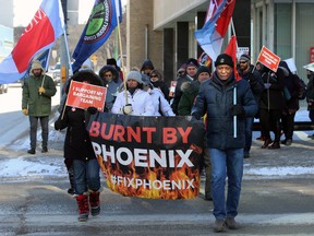 Supporters march across Broadway at Smith Street during a rally hosted by the Public Service Alliance of Canada in Winnipeg on Wed., Feb. 19, 2020 attempting to force the federal government's hand in compensating members affected by the Phoenix Pay System.