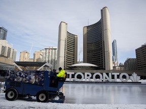 A Toronto city worker operates a Zamboni on the skating rink outside of Toronto City Hall after hearing that a tentative agreement has been reached between the City of Toronto and the city's outside workers, in Toronto, Saturday, Feb. 29, 2020. The Supreme Court of Canada will look at the legality of Ontario's decision to slash the size of Toronto's city council.