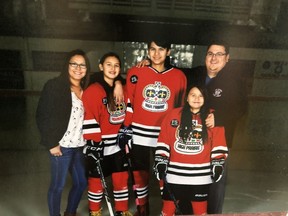 Shawn Auger (right) is shown with family members (from left) wife Jennifer Auger and children Shealynn, Eden, and Neriah in a family handout photo. The wife of Shawn Auger, a northern Alberta man who died this week of complications due to COVID-19, says he will be remembered as a loving father and someone who cared for the youth in his community.THE CANADIAN PRESS/HO-Jennifer Auger MANDATORYCREDIT