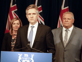 Ontario Finance Minister Rod Phillips talks at a COVID-19 update earlier in March, with Health Minister Christine Elliott and Premier Doug Ford.