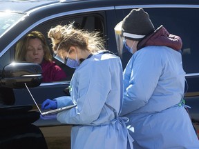 There was a lineup waiting at the Carling Optimist screening centre on Elizabeth Street on Sunday March 22, 2020.