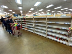 Shelves previously filled with pasta and canned food are seen empty at a Trader Joe's grocery store as shoppers gather supplies with coronavirus fears spreading in Encinitas, California, U.S., March 12, 2020.