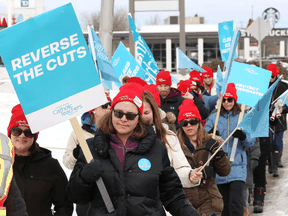 Members of the Ontario English Catholic Teachers' Association take part in strike action in Sudbury, Ont. on March 5, 2020.