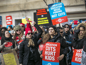 Ontario teachers and education workers picket outside of  The Fairmont Royal York Hotel in Toronto on Feb. 12, 2020.