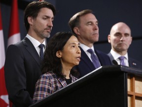Theresa Tam, Canada's chief public health officer, left, speaks while Justin Trudeau, Canada's prime minister, from left, Bill Morneau, Canada's finance minister and Jean-Yves Duclos, Canada's president of the treasury board, listen during a news conference on the coronavirus in Ottawa, Ontario, Canada, on Wednesday, March 11, 2020.