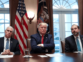 U.S. President Donald Trump is flanked by Vice President Mike Pence and Health and Human Services Secretary Alex Azar at a meeting of the coronavirus task force with pharmaceutical executives at the White House, March 2, 2020.