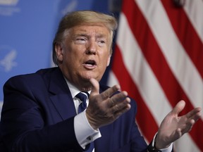 U.S. President Donald Trump speaks during a briefing at the National Institutes of Health Vaccine Research Center in Bethesda, Maryland, U.S., on Tuesday, March 3, 2020. Trump said he is weighing funding to treat the uninsured for coronavirus.