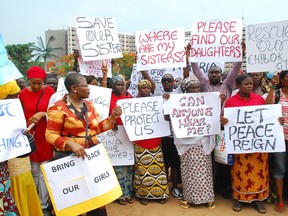 Former Nigerian Education Minister and Vice-President of the World Bank's Africa division (3rd L) Obiageli Ezekwesilieze speaks as she leads a march of Nigeria women and mothers of the kidnapped girls of Chibok, calling for their freedom in Abuja on April 30, 2014.