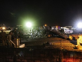 The wreckage of Lion Air Flight RPC 5880 is seen at the runway of Ninoy Aquino International Airport after it crashed on March 29, 2020 in Manila, Philippines. A medical evacuation charter plane headed for Haneda, Japan crashed on Sunday evening after taking off at Manila's international airport. All eight people on-board died, according to airport authorities.