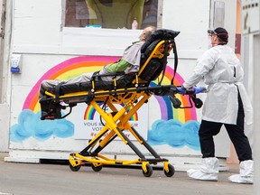 A patient is brought to the emergency department of the hospital in St. Eustache, Que., on April.