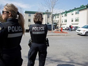 Police officers are seen outside Residence Herron, a senior's long-term care facility, following a number of deaths since the coronavirus disease (COVID-19) outbreak, in the suburb of Dorval in Montreal Quebec, Canada April 12, 2020.