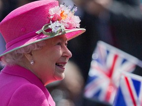 In this file photo taken on April 20, 2016 Britain's Queen Elizabeth II smiles as she arrives to open a bandstand at Alexandra Gardens in Windsor, west of London, the day before her 90th birthday.