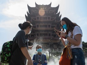 People visit Yellow Crane Tower after it reopened to the public in Wuhan in China's central Hubei province on April 29, 2020.