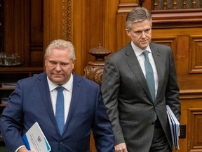 Ontario Premier Doug Ford and Finance Minister Rod Phillips arrive to deliver the 2020 Fiscal Update at Queen's Park in Toronto on Wednesday March 25, 2020.