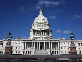 A jogger pushes a stroller while exercising in the deserted plaza in front of the U.S. Capitol in Washington, D.C., on April 15.