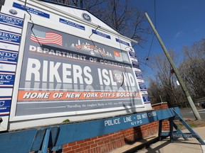 Signage is seen outside of Rikers Island, a prison facility, where multiple cases of the coronavirus disease (COVID-19) have been confirmed in Queens, New York City, U.S., March 22, 2020.