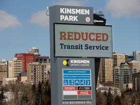 A sign at the Kinsmen Sports Centre notifies people that Edmonton transit services have been reduced due to the COVID-19 pandemic, in Edmonton on April 2.