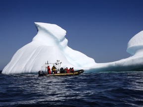 A tour boat takes tourists up close to an iceberg in Bonavista Bay, N.L. on Tuesday, June 11, 2019.